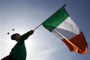 A boy holds a Republic of Ireland flag