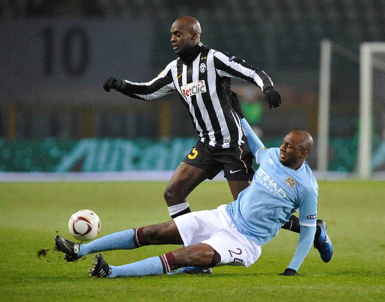 Juventus' Sissoko is challenged by Manchester City's Vieira during their Europa League soccer match at the Olympic stadium in Turin