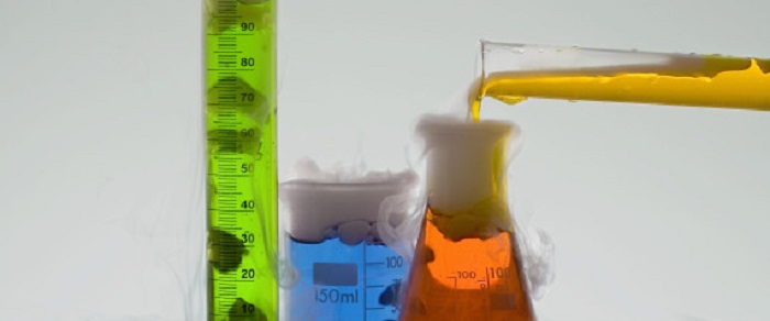 Beakers and cylinders with colorful liquids